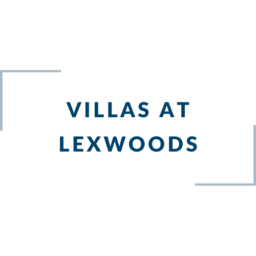 A blue and white sign that says Villas at Lexwoods.